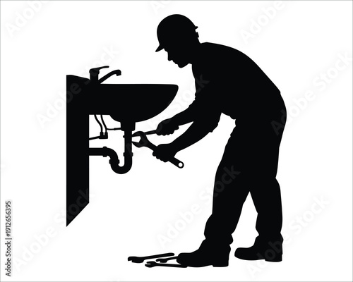 Plumber fixing a sink with a wrench