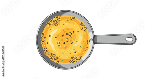 Overhead view of delicious golden scrambled eggs bubbling in a shiny pan ready for a tasty breakfast meal