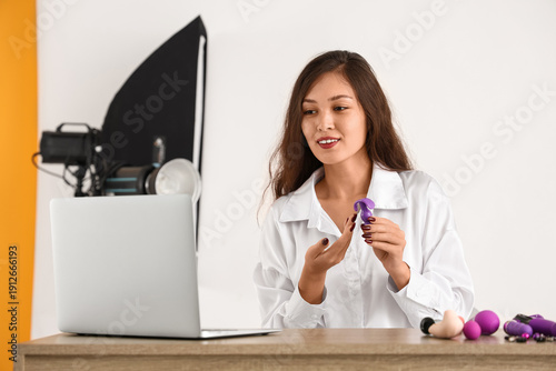 Female Asian blogger with a...