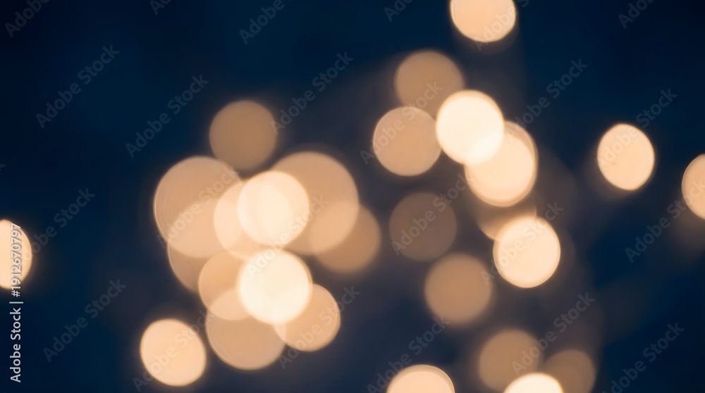 Fototapeta premium Blurry bokeh lights against a dark blue background.