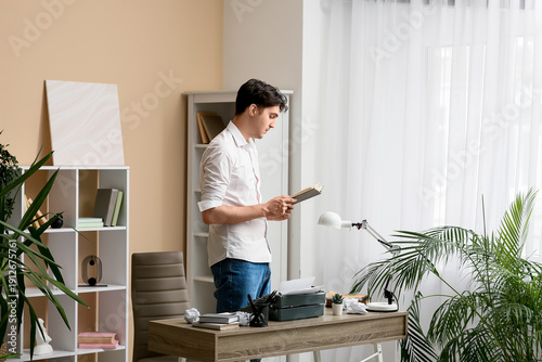 Young writer with book and ...