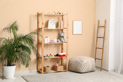 Rack with children toys, po...