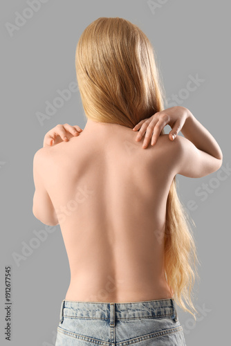 Topless woman from behind w...