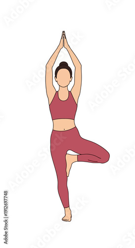 Woman performing Vrikshasana yoga pose, standing on one leg with arms raised
