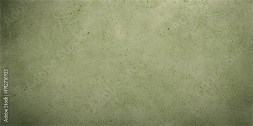 Green grunge textured paper background with vintage aged look and copy space