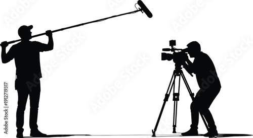 Silhouette of professional film crew on movie set with camera operator on tripod and sound engineer holding boom microphone for video production