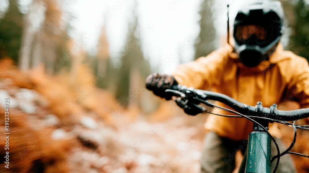 Fototapeta premium An exhilarating scene capturing a mountain biker navigating a rugged trail surrounded by colorful autumn foliage, embodying energy and thrill of outdoor adventures.
