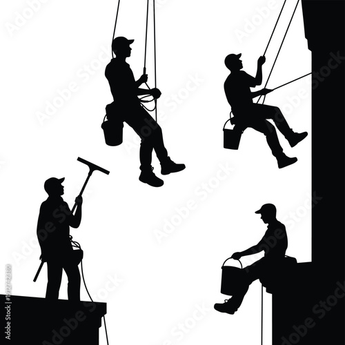 Silhouetted window washers suspended on ropes against a bright sky