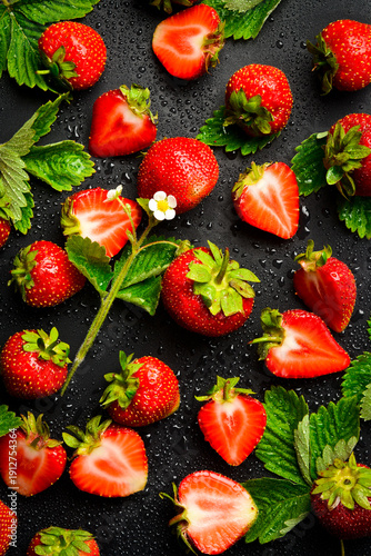 Delicious, fresh strawberries on a concrete background. Top view.