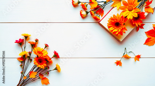 Cheerful Autumn Flat Lay with Orange Daisies and Fallen Leaves on a White Wooden Surface