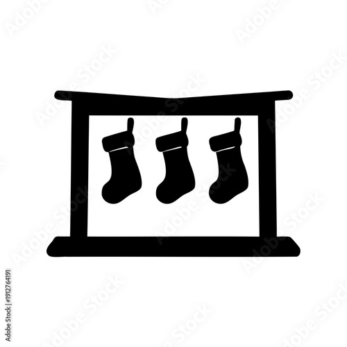 Silhouette of Christmas mantelpiece with festive stockings hanging from it