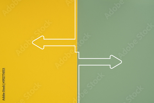 opposite directions arrow shape on green and yellow color with copy space