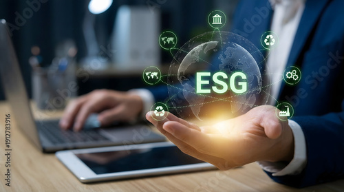 Photos Businessman promoting ESG practices with global network visualization