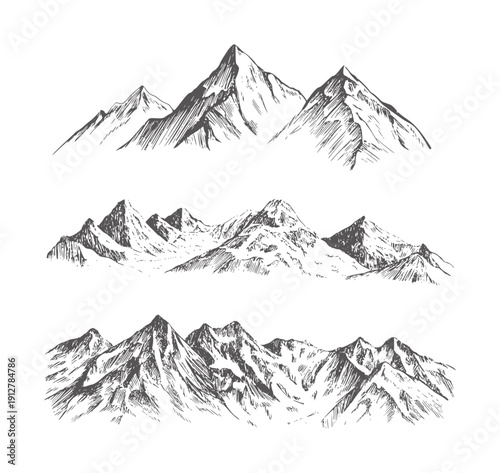 Three black and of rugged mountain ranges with sharp peaks mountains