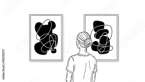 Person observing minimalist abstract art in gallery setting