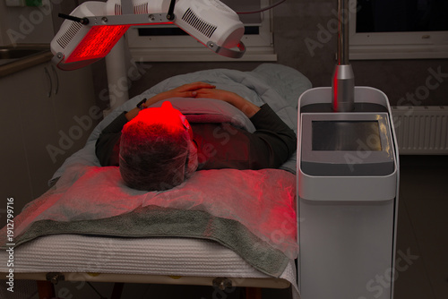 Facial LED Light Therapy Treatment in a Beauty Clinic with Red Light and Eye Protection