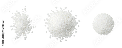 Photography Top view of three piles of coarse sea salt crystals scattered in different arrangements, isolated on a transparent background
