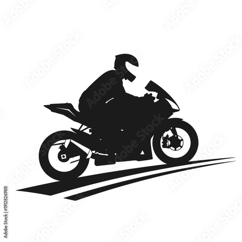 Silhouette of a motorcyclist riding a sport bike at speed