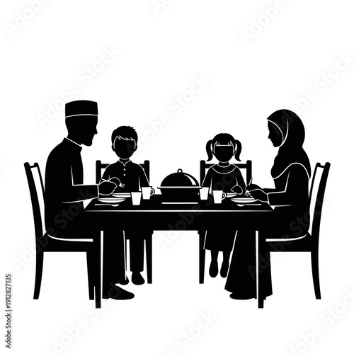 A family of four sharing a meal together at a dining table