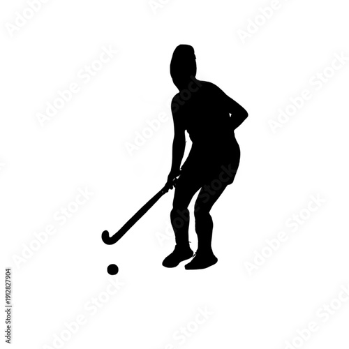 Silhouette of girl holding a field hockey stick.