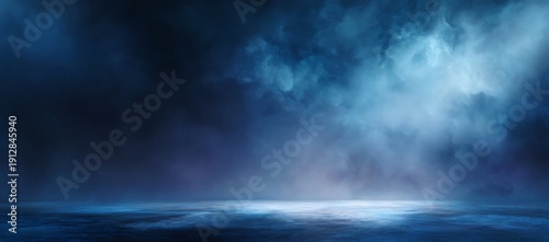 Dramatic dark blue cloudy scene with mysterious light beam