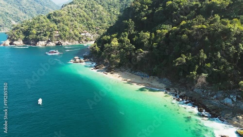 Aerial drone shot of beautiful madagascar beach with turquoise water in puerto vallarta, mexico