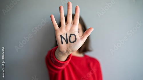 Woman showing no gesture with hand stop violence concept
