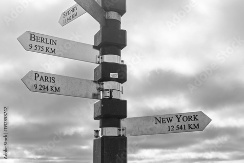 South Africa - Cape Town - Cape Point - Iconic distance signpost under cloudy sky