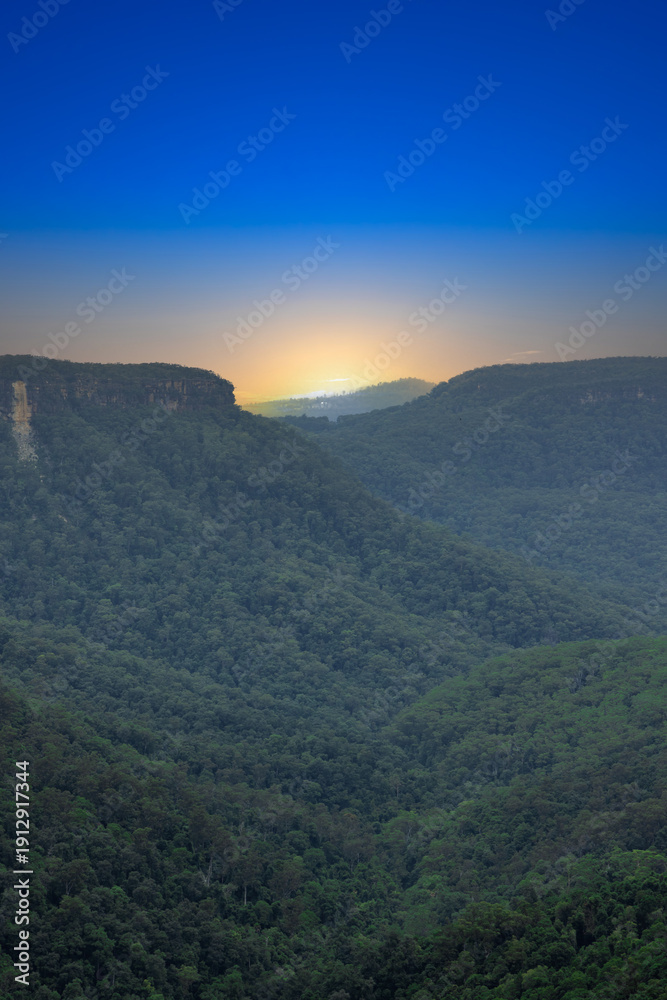 Fototapeta premium Beautiful flowing River in Fitzroy water Falls in Bowral NSW Australia beautiful colourful cloudy skies lovely waterfalls