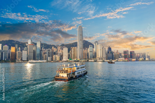 Photography A ferry boat departing to the other side of Victoria Harbor in Hong Kong with sk