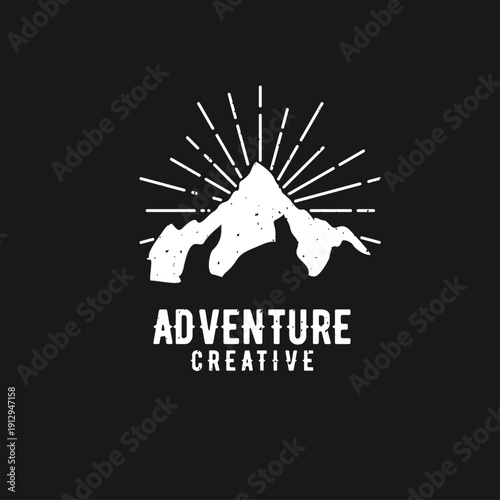 Grunge Mountain Adventure Creative Logo Design with Sun Rays on Black Background