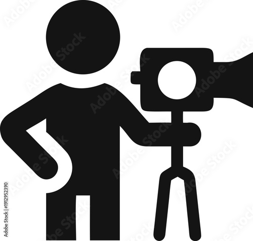 Professional Cameraman Filming with Video Camera on Tripod for Media Production