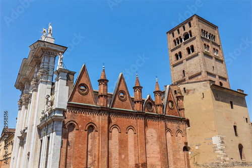 Wallpaper Mural Mantua Cathedral, also known as the Basilica of St. Peter the Apostle, stands prominently in Mantua. This structure displays its unique features against a clear blue sky. Torontodigital.ca