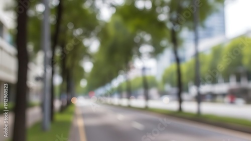 Blurred city street with trees and buildings