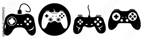 Set of four black gaming controllers isolated on white background for esports and entertainment