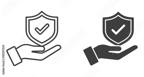 Security shield with checkmark held by hand representing safety and insurance guarantee