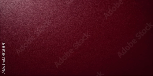 A dark red grunge wallpaper features an old vintage paper texture and a blank surface with copy space over a deep purple leather material backdrop