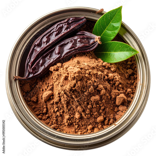 Organic carob powder in metal tin with whole pods and fresh leaves isolated on white background