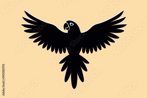 Majestic black silhouette of a bird in full flight against a warm background