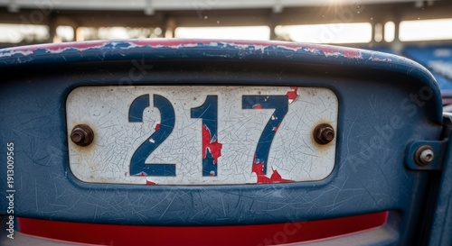 Close-up of old license plate number.
