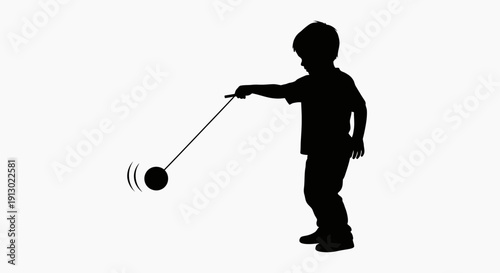 Boy Playing with Pendulum Motion Toy.