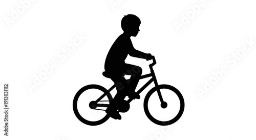 Silhouette of a boy riding bicycle.