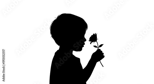 Silhouette of a child smelling a flower.