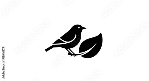 Black Bird Silhouette on Leaf Branch.