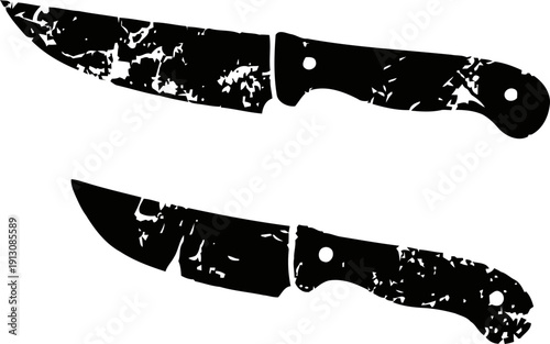 Two worn black silhouette knives with textured distressed effect isolated on white background