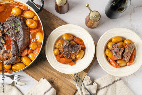 Fotografie Hearty food. Beef pot roast with roasted vegetables