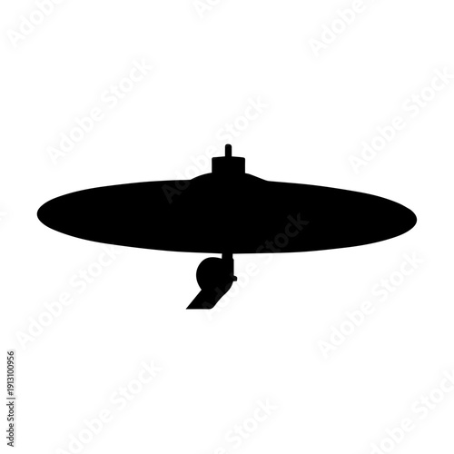 A silhouette of a cat perched on the edge of a large, flat, circular frisbee