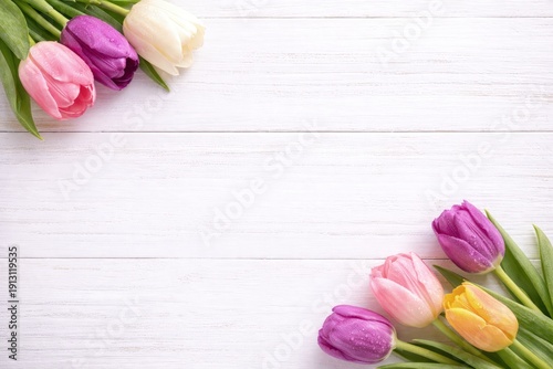 Wallpaper Mural Spring tulips on white wooden table, top view floral background with copy space in center, fresh seasonal banner for greeting card, spa backdrop and minimal design template Torontodigital.ca