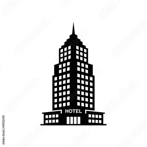Silhouette of a tall hotel building with many windows.