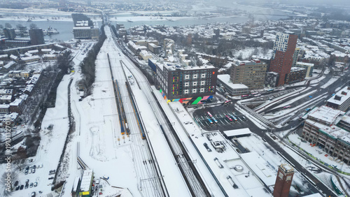Silent White Streets: An aerial view of Nijmegen's rooftops and alleys settled into a peaceful snow day.
